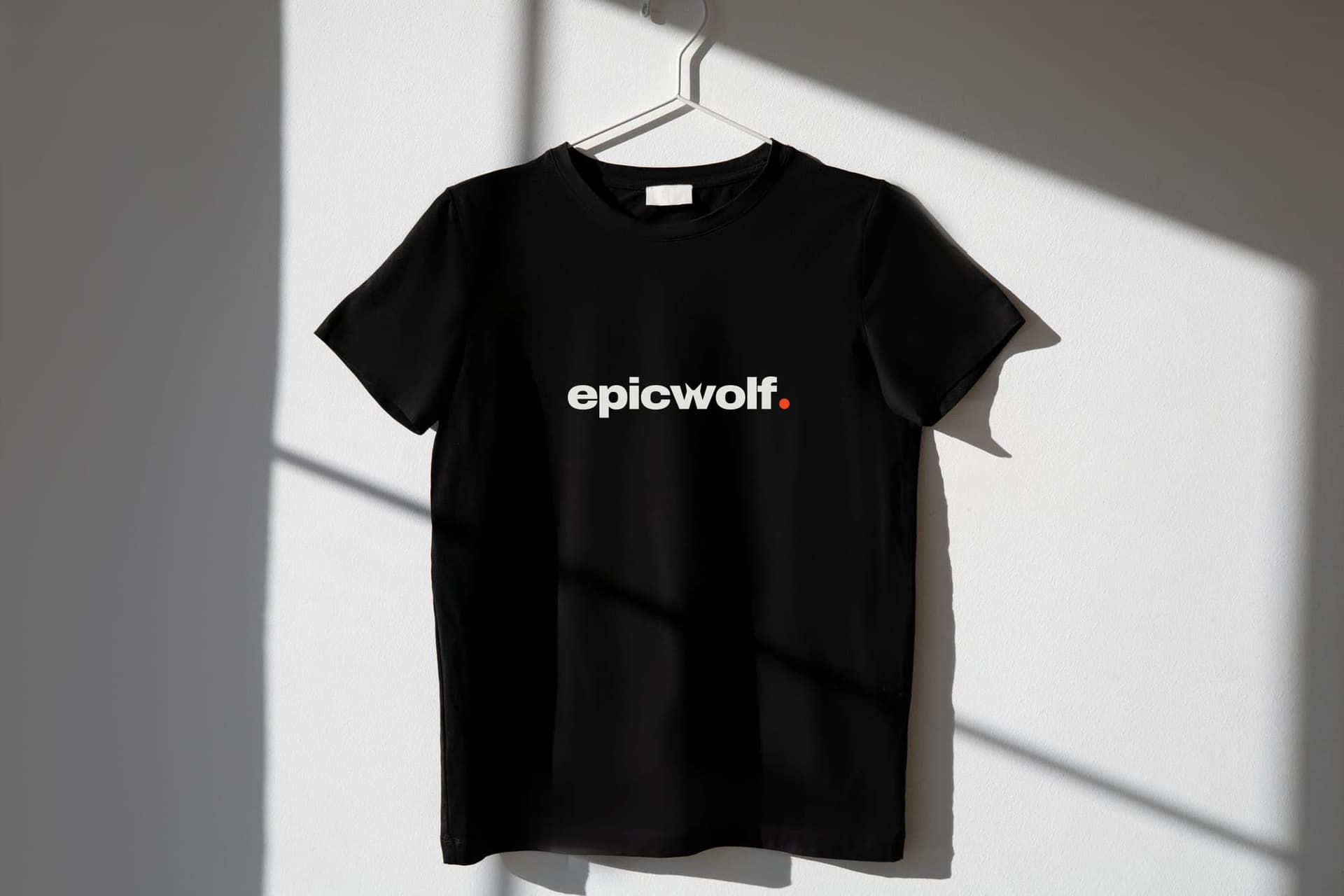A black T-shirt printed with the Epic Wolf wordmark