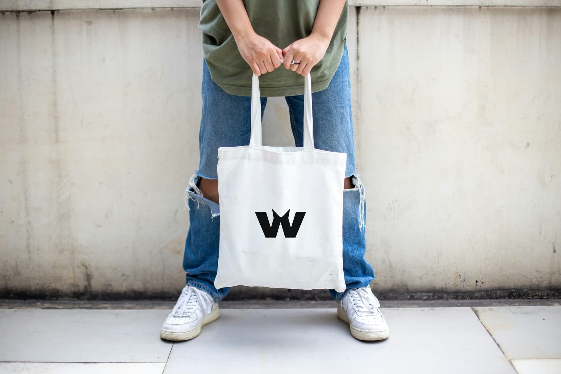 A canvas tote printed with the Epic Wolf mark