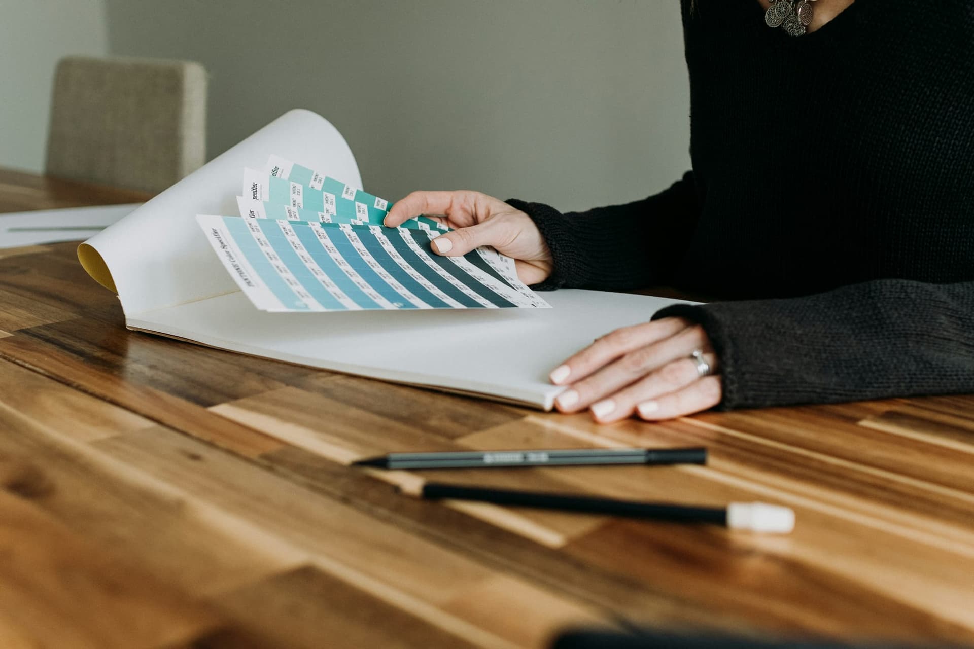 A printed color swatch book fanned open