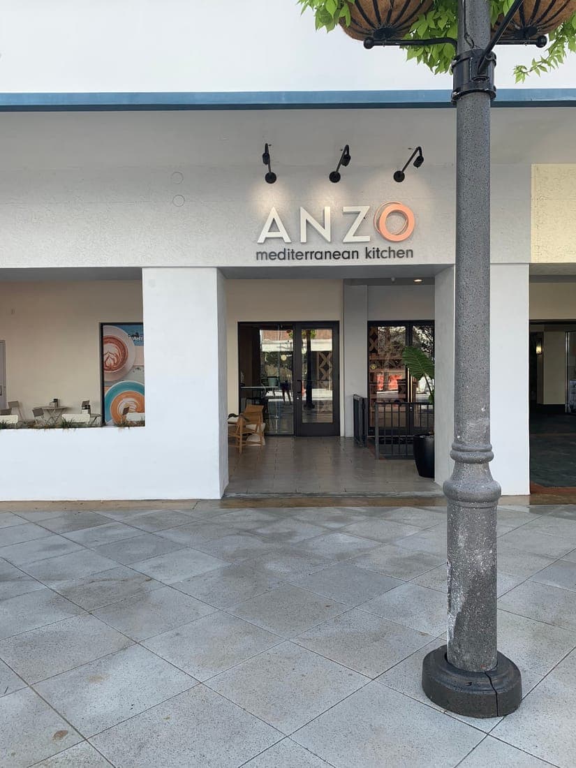 Dimensional exterior sign over a Mediterranean kitchen