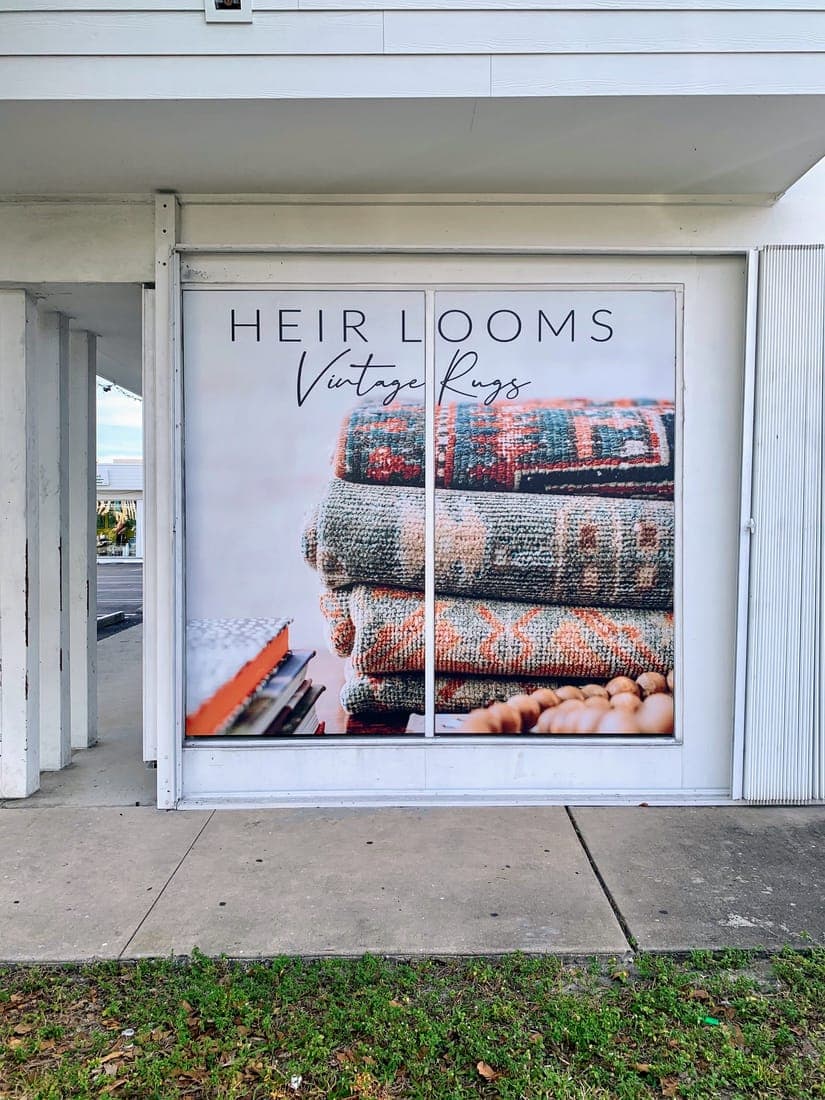 Full-window photo graphics on a rug gallery storefront